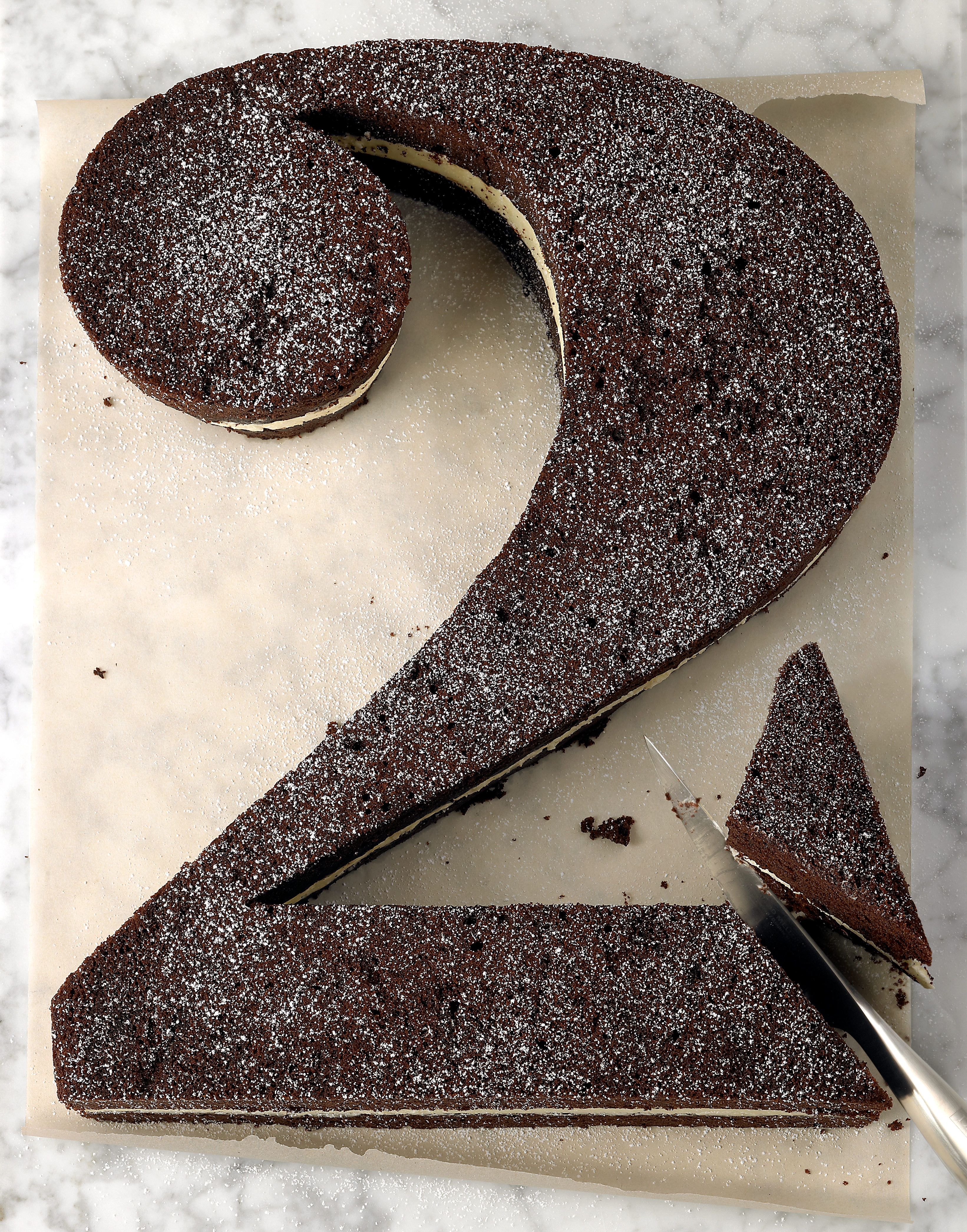 Craft woodware, pottery and basketware items on a dark background.