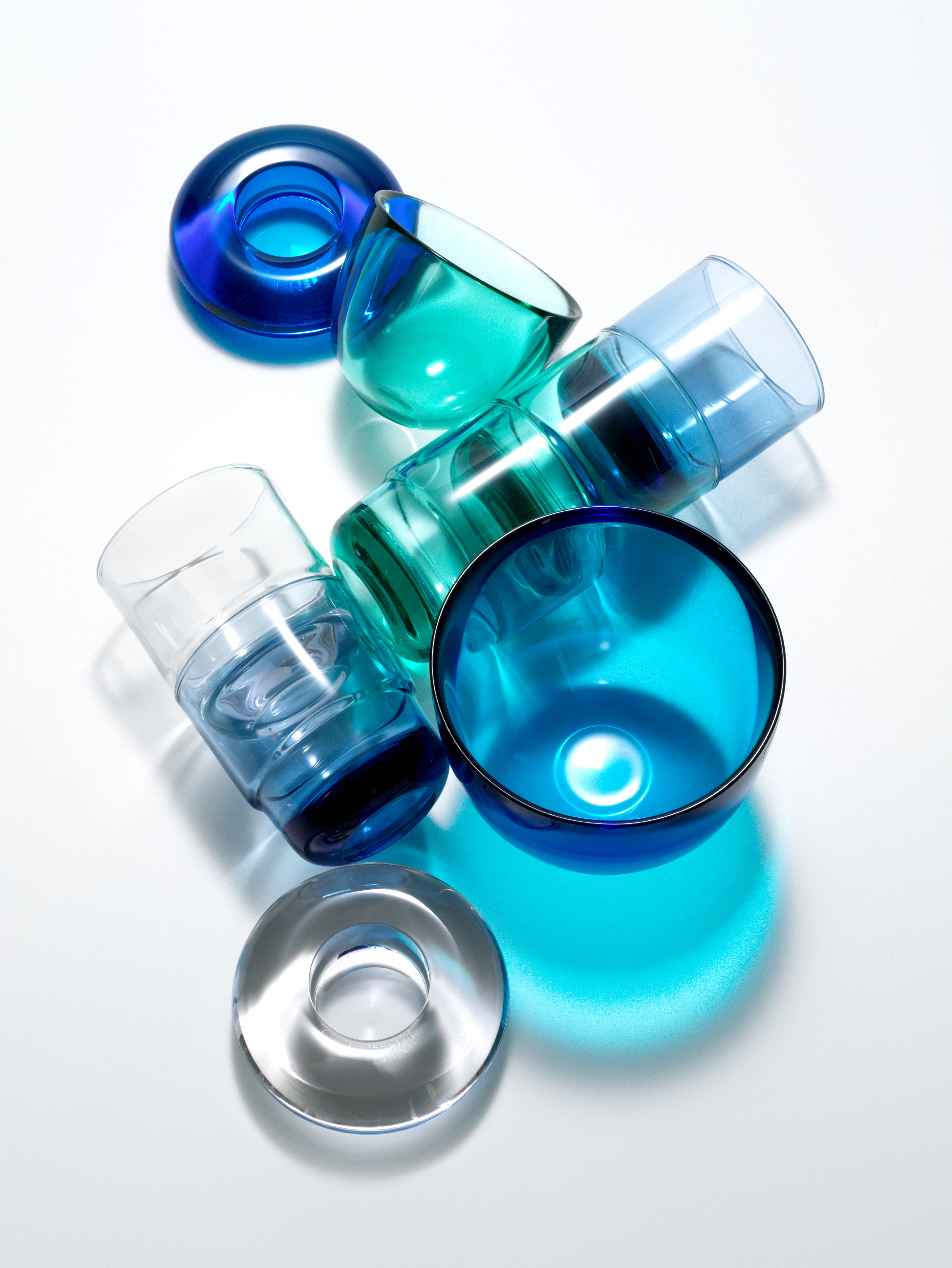 A chocolate cake in the shape of the number 2 with knife cutting a piece.