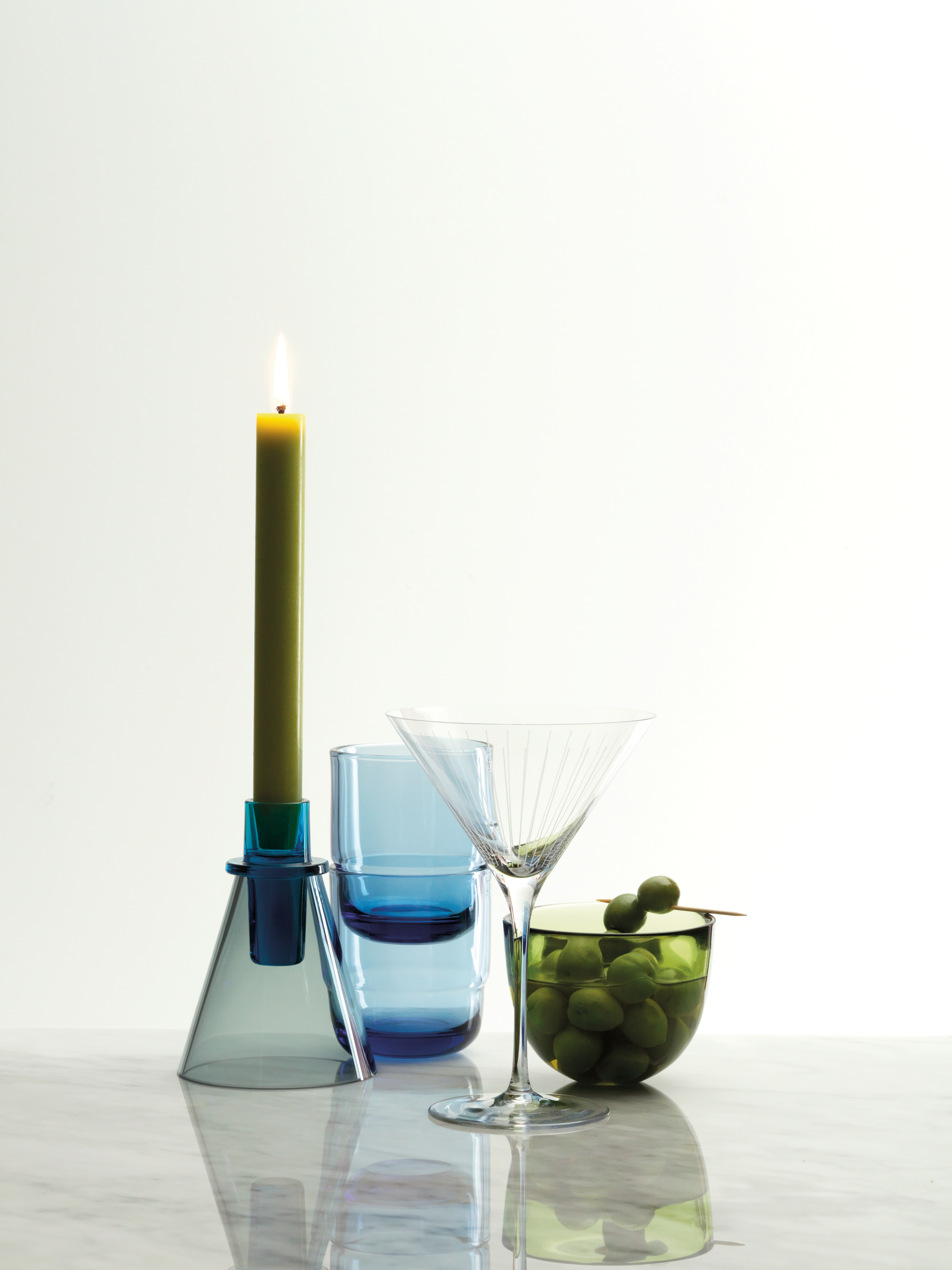 Gold dress scrunched up on a white background.